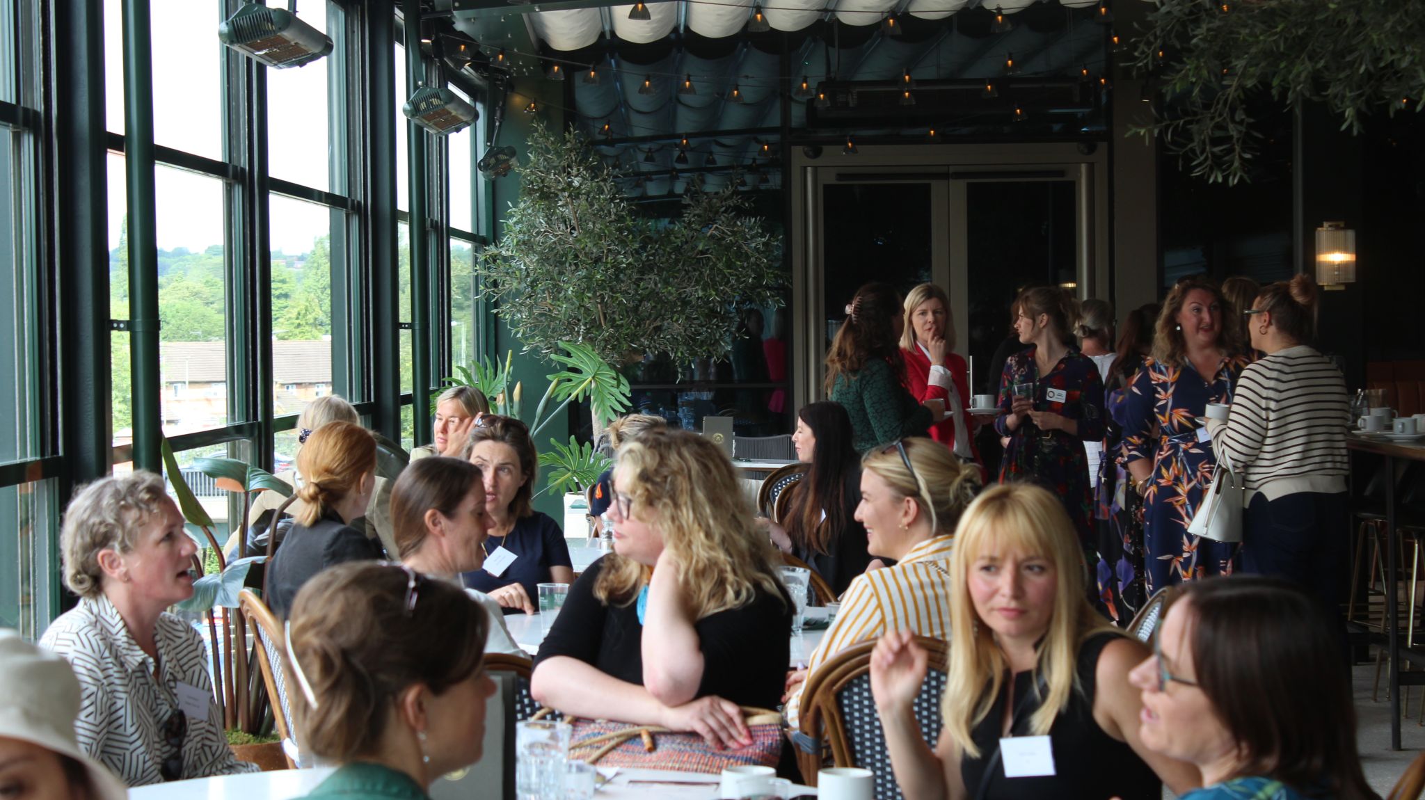 Groups of women discuss business topics at OxLEP Business's Women in Business 2023 event
